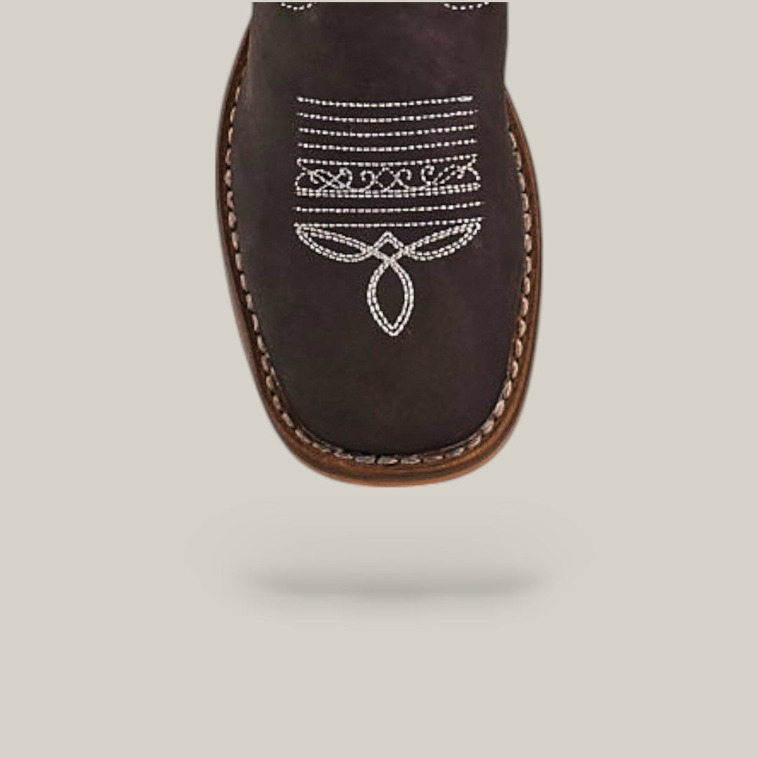 A close-up of the Amara Suede Oxford - Square Toe Kids Boot in brown, featuring white decorative stitching and quality craftsmanship, shown against a plain light background with a shadow beneath.