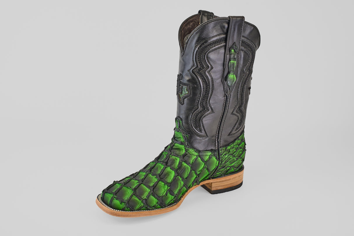 The Conor - Swamp Green - Square Toe boot features a black leather upper, vibrant green scale-patterned lower reminiscent of Pirarucu Fish Boots, wooden sole, and low heel, shown against a plain white background.
