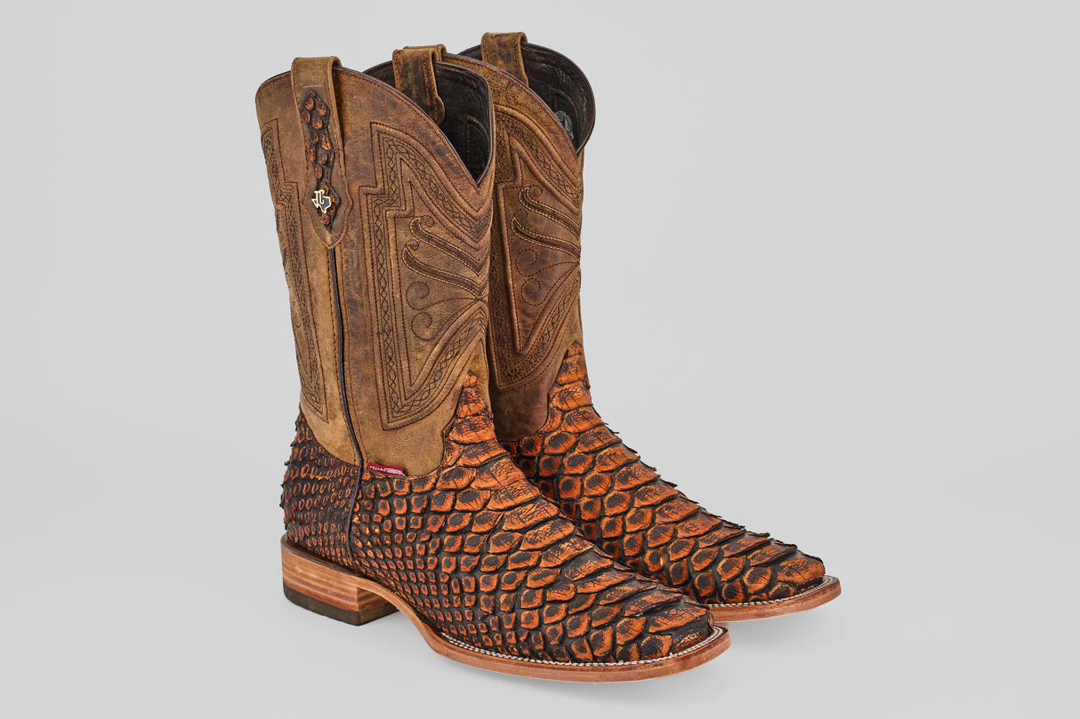 The Tanner Jumbo – Chestnut – Square Toe boots feature intricate brown leather uppers, textured orange and black python lowers, and decorative stitching on the shafts for a bold, stylish look.