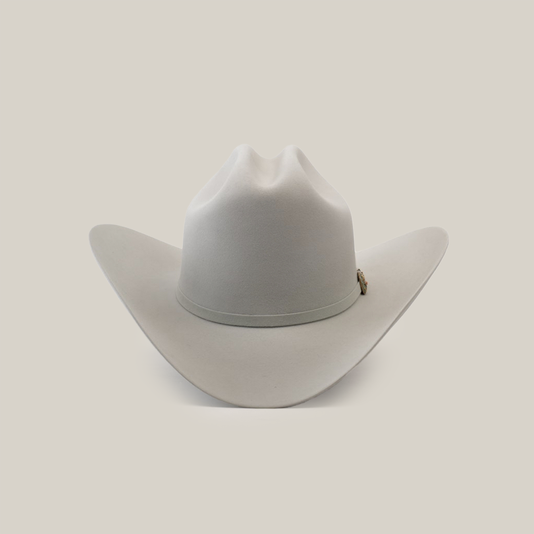 The 500X Superior Platinum cowboy hat is a luxury Western accessory featuring a wide brim and creased crown, crafted from premium belly beaver fur in plain white.