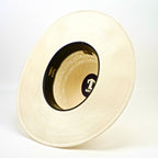 Beige straw hat with a brand logo on a white background