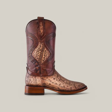 The Exotic Carunga - Diamond - Natural - Square Toe is a brown cowboy boot featuring a leopard print design on the lower part and intricate stitching on the upper shaft, made from genuine exotic leather, standing out against a plain light gray background.