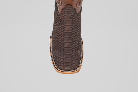 A close-up top view of the Tanner - Matte Brown - Square Toe cowboy boot, crafted in brown with a square toe and decorative stitching, set against a plain white background.