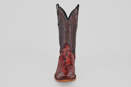 A single Tanner – Ruby – Narrow Square Toe cowboy boot in red python leather with intricate stitching, upright and facing forward against a plain white background.
