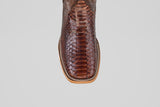 Top view of the Tanner - Brown - Square Toe cowboy boot, showcasing its textured, scaly snakeskin pattern and detailed stitching along the light tan sole.