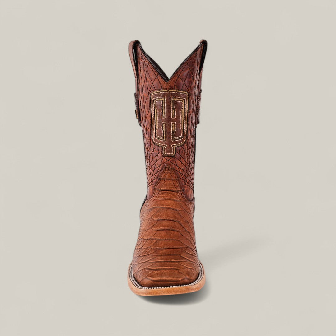 A single Python Print Rustic Cogñac - Square Toe cowboy boot with a textured, snakeskin-like pattern and an embroidered monogram logo on the front, displayed upright against a plain light background.