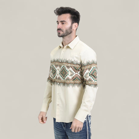 A man wears the Mens Western Modern Fit Cotton/Spandex Long Sleeve Beige Shirt with Snaps (WPL10677), featuring a modern fit, paired with blue jeans, standing against a plain light background.