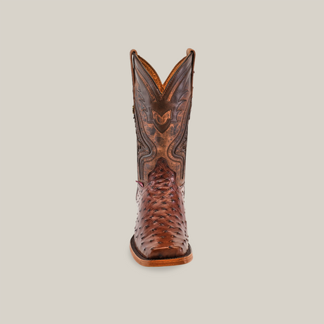 The Exotic Ostrich - Brown - Rodeo Toe boot showcases superior craftsmanship with intricate stitching and patterns on the shaft. The textured design on the toe enhances its artisanal beauty, standing centered on a plain white background.