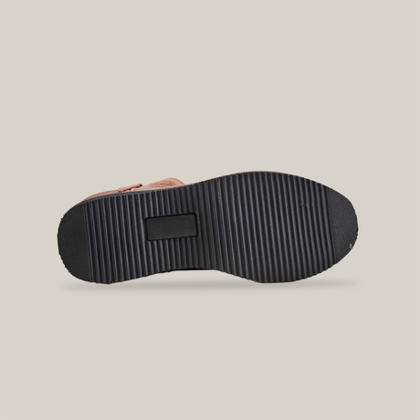 This image shows the bottom view of the Brandy Roper - Laredo Sole - Soft Toe, highlighting a black ridged sole inspired by Western bootmaking. A central rectangular groove is visible. The premium cowhide leather brown upper showcases timeless craftsmanship.